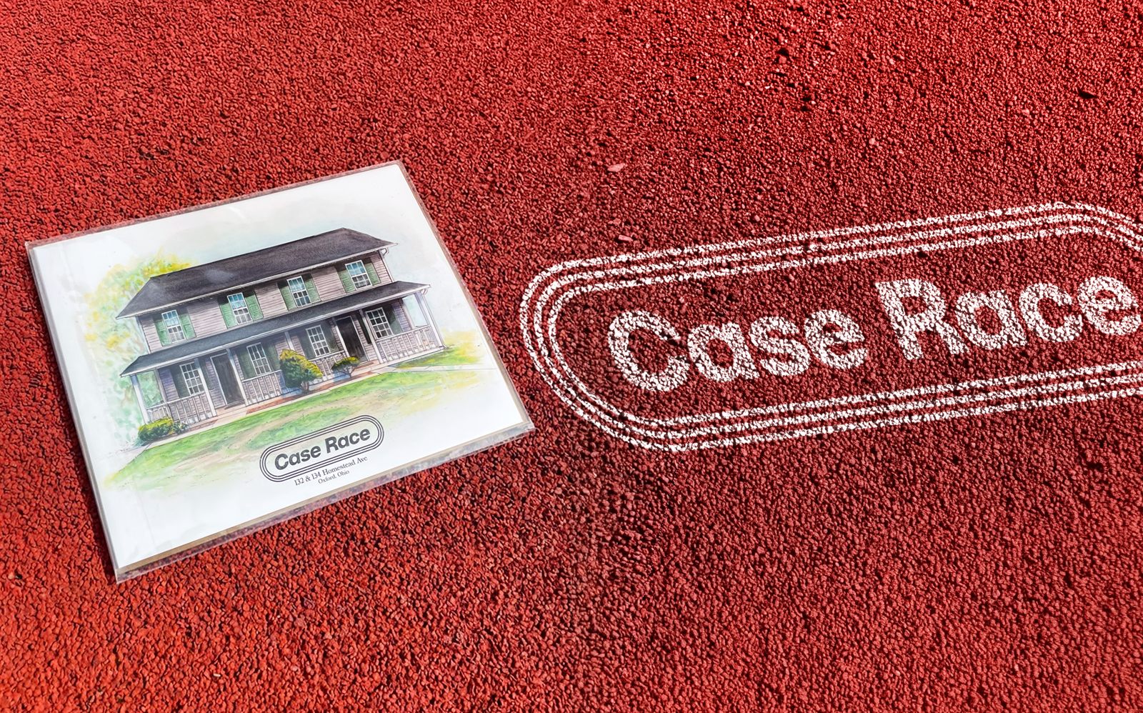 Watercolor portrait print of the Case Race house resting on a red running track with the logo chalked beside it